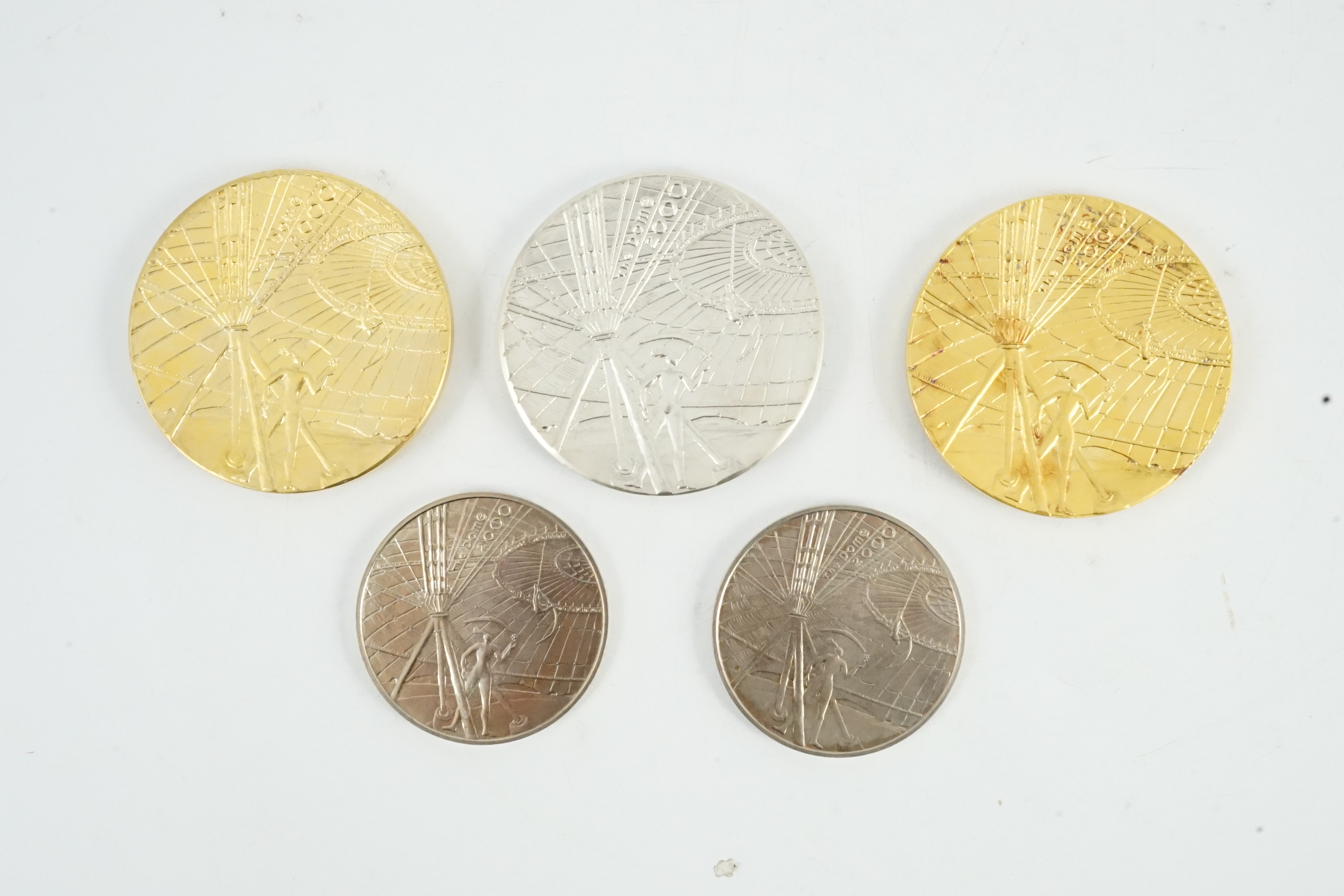 Jacqueline Stieger (b.1936) for Royal Mint, two prototype silver-gilt (Millennium) Dome medals, and a similar first strike silver medal